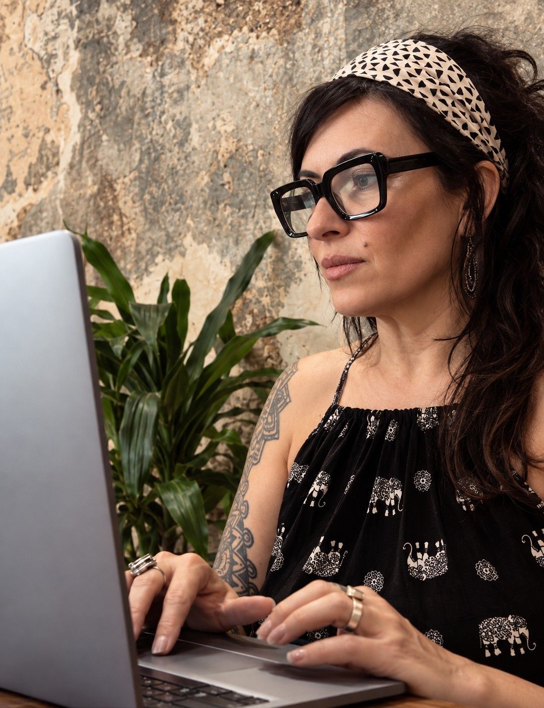 Lori Bellman writing at a laptop
