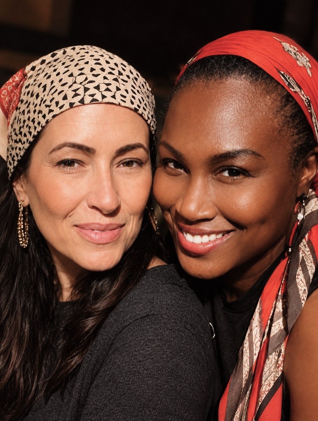 Lori Bellman and Erika Roman Saint-Pierre smiling together in a close portrait
